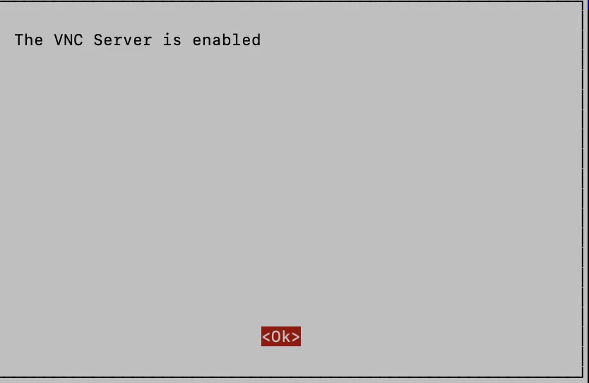 Сообщение об успешном включении VNC-сервера в raspi-config: текст 'The VNC Server is enabled' и кнопка Ok